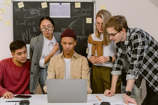 A person using a laptop to fact-check information