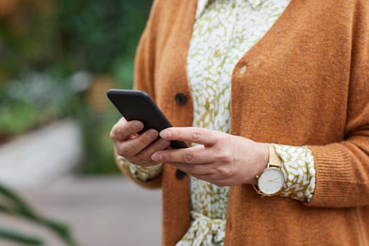 A person using a phone to fact-check information
